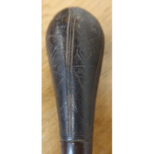 241 - A tribal club, possibly Maori or from the South Pacific region, with bulbous carved end and tapering... 