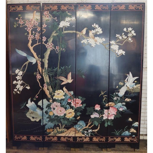 29 - A 20th century Chinese four fold lacquered screen, decorated with flowers, trees and birds, each pan... 