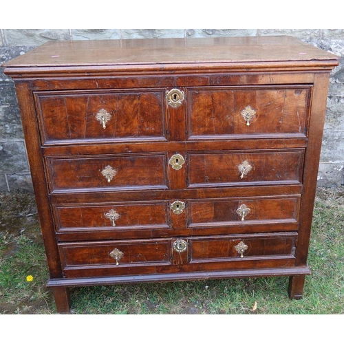 30 - An antique oak chest, of four long drawers with panelled fronts, 40.5ins x 23ins x height 37.5ins