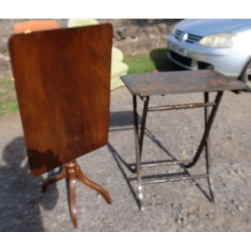 47 - A mahogany tilt top table, together with a folding table with poker work style decoration