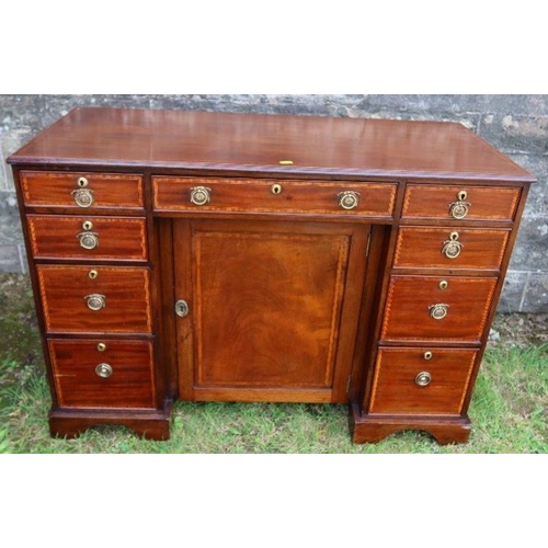 52 - An Edwardian desk, with cross banded decoration, fitted with a central frieze drawer flanked by two ... 