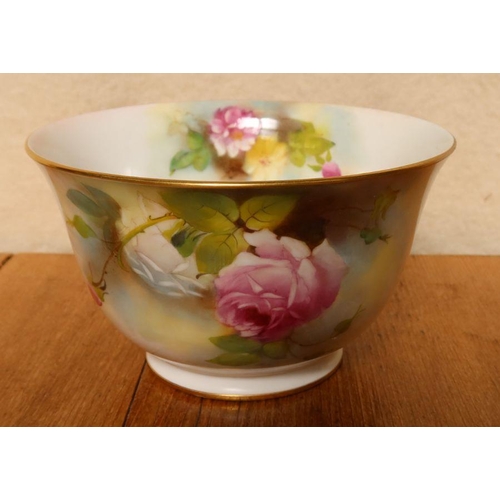 571 - A Royal Worcester bowl, decorated with roses by M Lander, restored, diameter 6.25ins, height 3.75ins