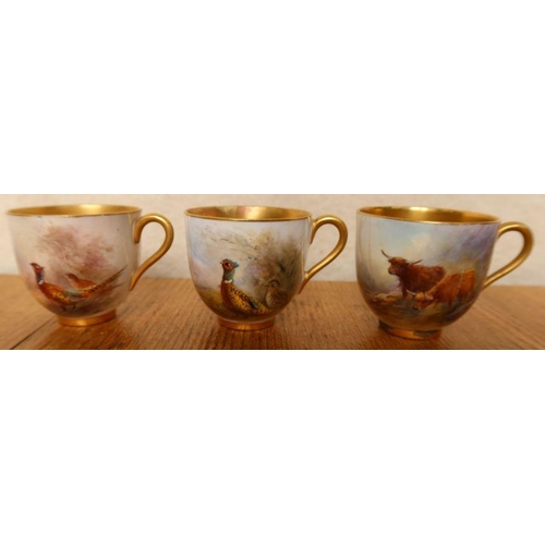 573 - Three Royal Worcester cabinet cups, two decorated with pheasants by Jas Stinton and one with Highlan... 