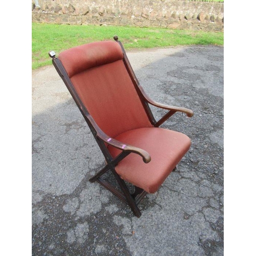 62 - An Edwardian mahogany framed armchair, with upholstered seat and back, on reeded cross frame