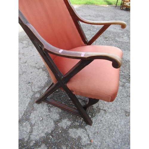 62 - An Edwardian mahogany framed armchair, with upholstered seat and back, on reeded cross frame