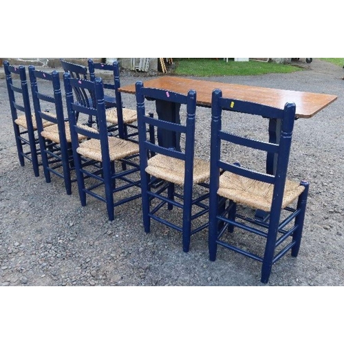 66 - A set of seven painted kitchen chairs with rush seats, together with another painted kitchen chair, ... 