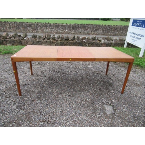 69 - A Danish Bramin extending dining table. Width 35ins, max length 77 ins.