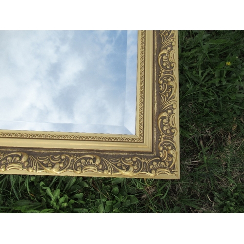 148 - A modern gilt frame mirror, with beveled plate, 34.5ins x 23ins