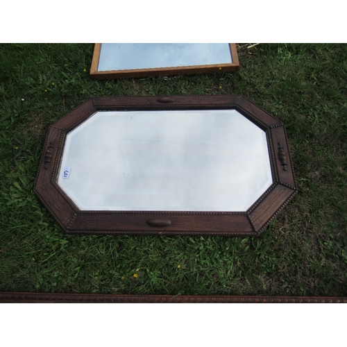 151 - An oak framed mirror, 39ins x 9.5ins together with two others