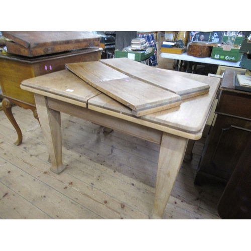 106 - An extending oak dining table, width 48ins, max. length, 56ins