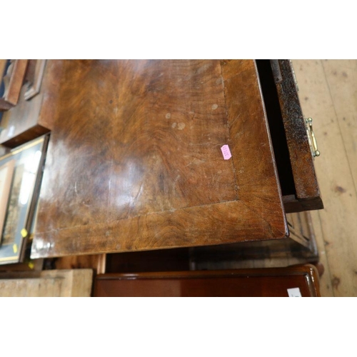 11 - An 18th Century walnut chest of drawers, having two short over three long drawers, raised on bracket... 