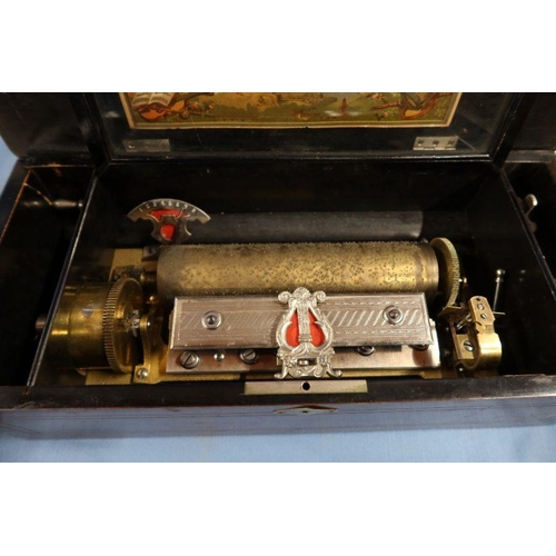 124 - A 19th century Swiss table top cylinder music box, playing 8 airs, with paper label to interior of t... 