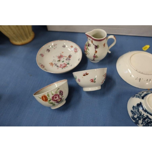 158 - An early 19th century porcelain sparrow beak jug, together with two tea bowls and a saucer decorated... 