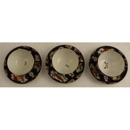 172 - Two18th century Worcester teacups and saucers, the scale blue ground decorated reserve panels of ins... 