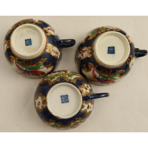 172 - Two18th century Worcester teacups and saucers, the scale blue ground decorated reserve panels of ins... 