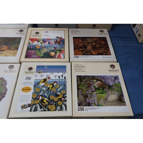 196 - 22 Wentworth Wooden Puzzles, boxes, four 500 pieces puzzles, one 225 puzzles and seventeen 250