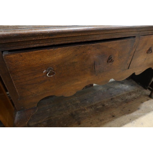 2 - An Antique oak dresser, with a boarded back plate rack, width 59ins, height 82ins