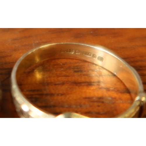 219 - A small 9ct gold ring, weight 1.2g, and three other rings