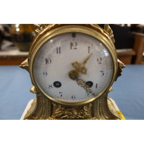 249 - A gilt metal and marble mantel clock, with striking movement