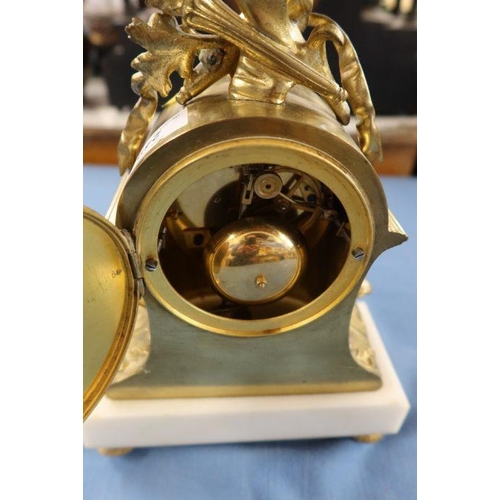 249 - A gilt metal and marble mantel clock, with striking movement