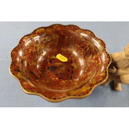 251 - A cloisonne bowl, on a wooden stand, together with a clay model of a kneeling figure