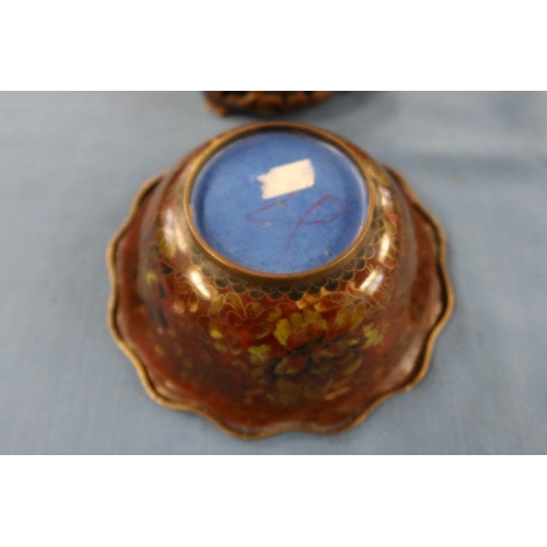 251 - A cloisonne bowl, on a wooden stand, together with a clay model of a kneeling figure