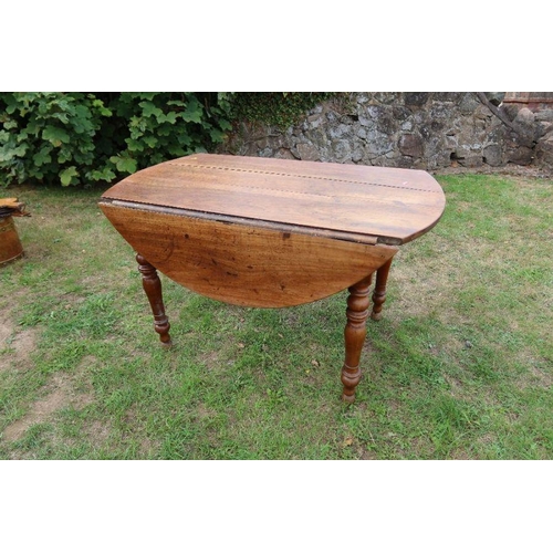 29 - A fruitwood kitchen table