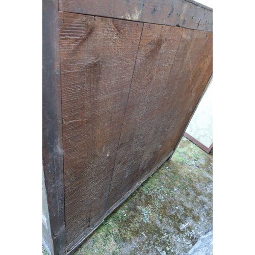 3 - An antique oak court cupboard, fitted with two cupboards to the upper section, and a central cupboar... 