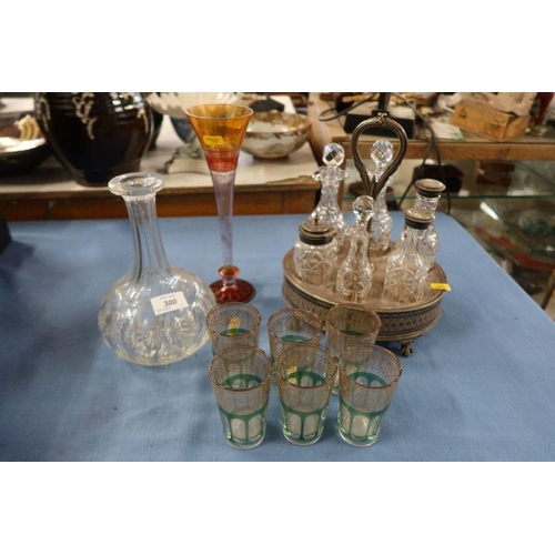 300 - A set of six tumblers, together with a silver plated cruet set, a decanter (missing stopper) and a v... 