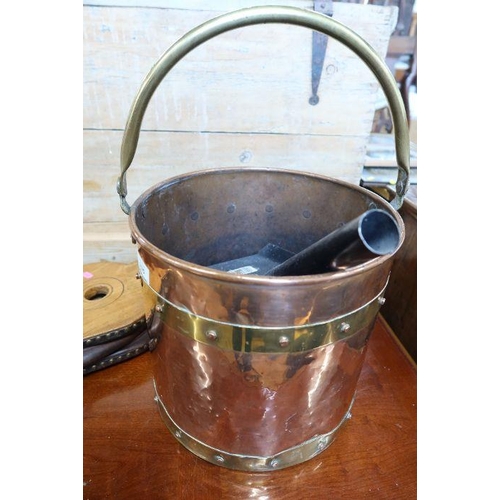 335 - A copper and brass bound coal bucket, together with oak bellows