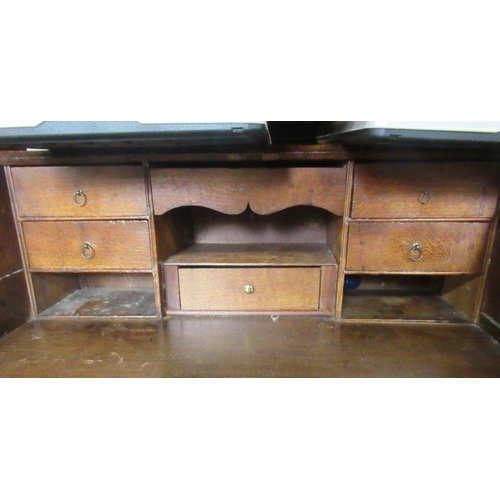 53 - An Antique oak bureau, with lozenge decoration, width 31ins