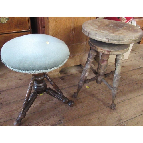 57a - A circular revolving stool, raised on turned column with turned supports, diameter 14.5ins, together... 