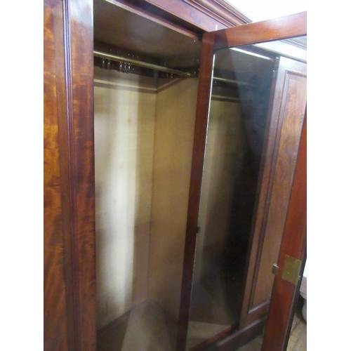 76 - A mahogany wardrobe, width 57ins, height 77ins