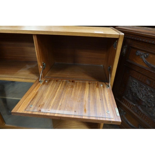 9 - A retro set of glazed shelves, width 48ins, height 37.5ins together with a walnut cabinet, raised on... 