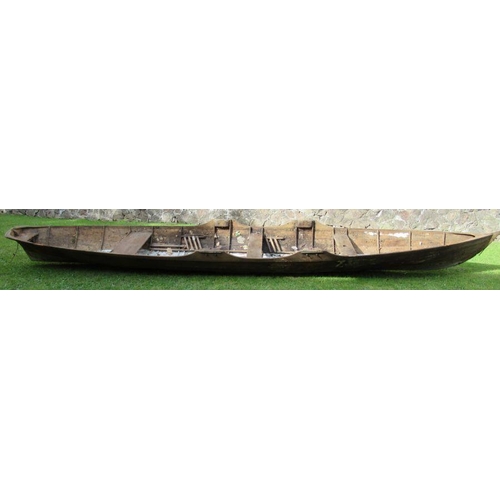 99 - A rowing boat/scull, with three seats, length 260ins, width 46ins