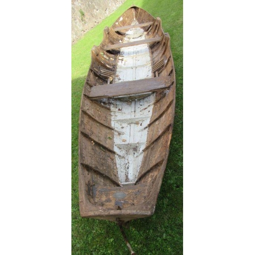 99 - A rowing boat/scull, with three seats, length 260ins, width 46ins