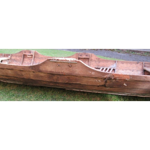 99 - A rowing boat/scull, with three seats, length 260ins, width 46ins