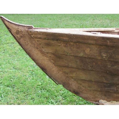 99 - A rowing boat/scull, with three seats, length 260ins, width 46ins