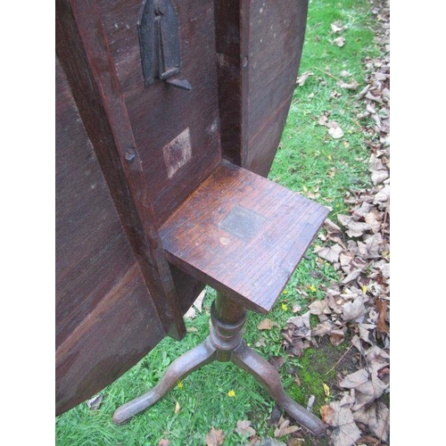 108 - A 19th century oak tripod table, diameter 30ins