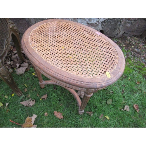 110 - A continental style caned jardinière together with a caned stool