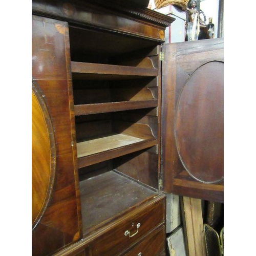 137 - A Late Georgian mahogany linen press, with oval veneered panels, fitted three slide out trays, two s... 