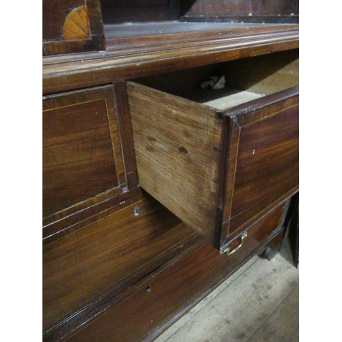 137 - A Late Georgian mahogany linen press, with oval veneered panels, fitted three slide out trays, two s... 