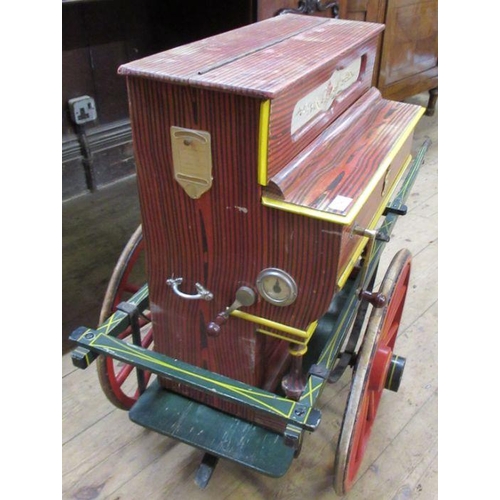 140 - A Spanish Faventia of Barcelona miniature barrel organ, together with painted cart, and further roll... 