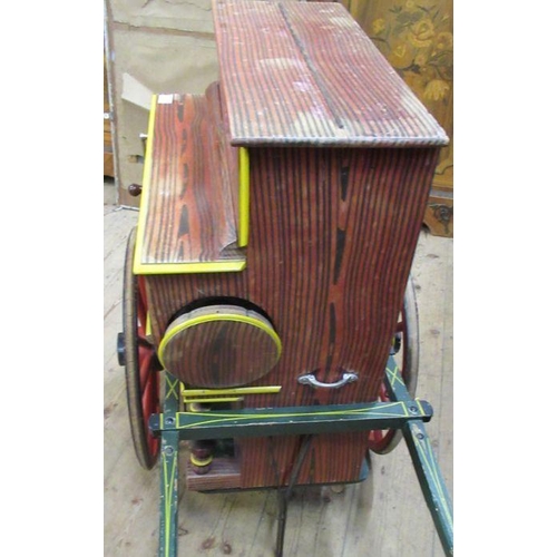 140 - A Spanish Faventia of Barcelona miniature barrel organ, together with painted cart, and further roll... 