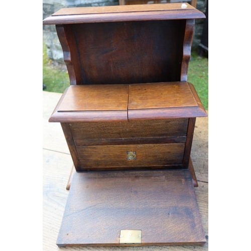 150 - An Edwardian mahogany and satinwood inlaid coal box, with sloping fall flap, together with an oak bo... 