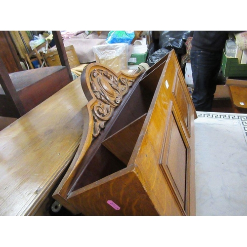 152 - An Edwardian hanging magazine rack, with carved decoration