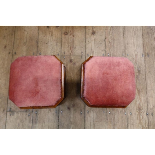 155 - A pair of mid Victorian octagonal mahogany upholstered footstools on block feet with lift-up lid enc... 