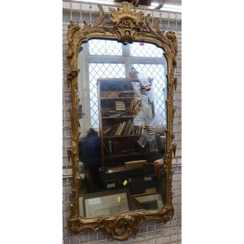 156 - A 19th century gilt framed wall mirror, the frame decorated with flowers and scrolls, overall size 5... 