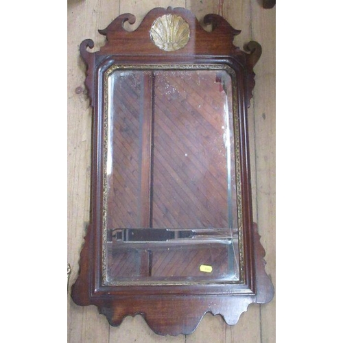 157 - An Antique mahogany framed wall mirror, with shell and scroll decoration, bevelled glass plate, over... 