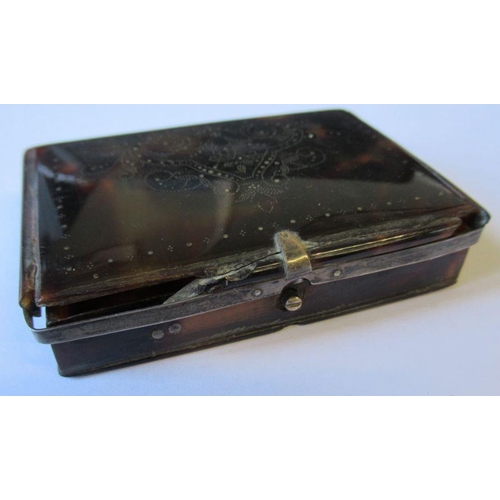 242 - A Georgian tortoiseshell snuff box, with scroll decoration to the top and white metal mounts, 3ins x... 